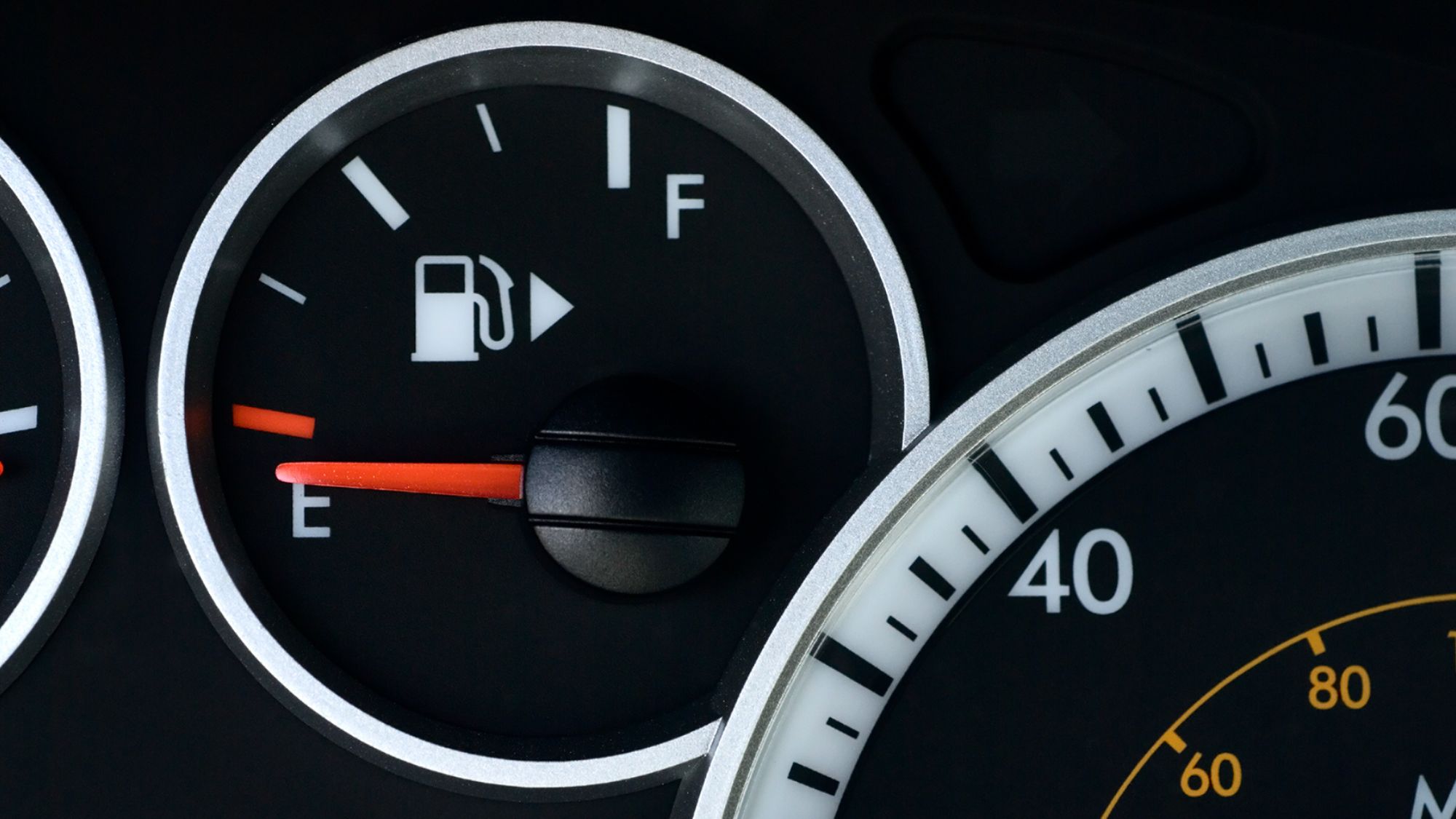 A car's speedometer showcasing fuel efficiency