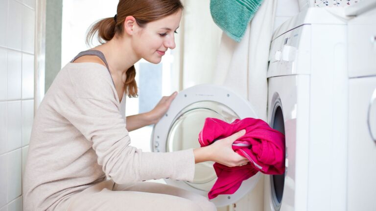 A lady trying to clean and care blankets