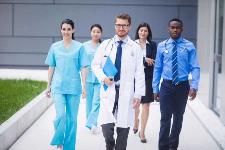 Doctors are walking and wearing Medical Uniforms